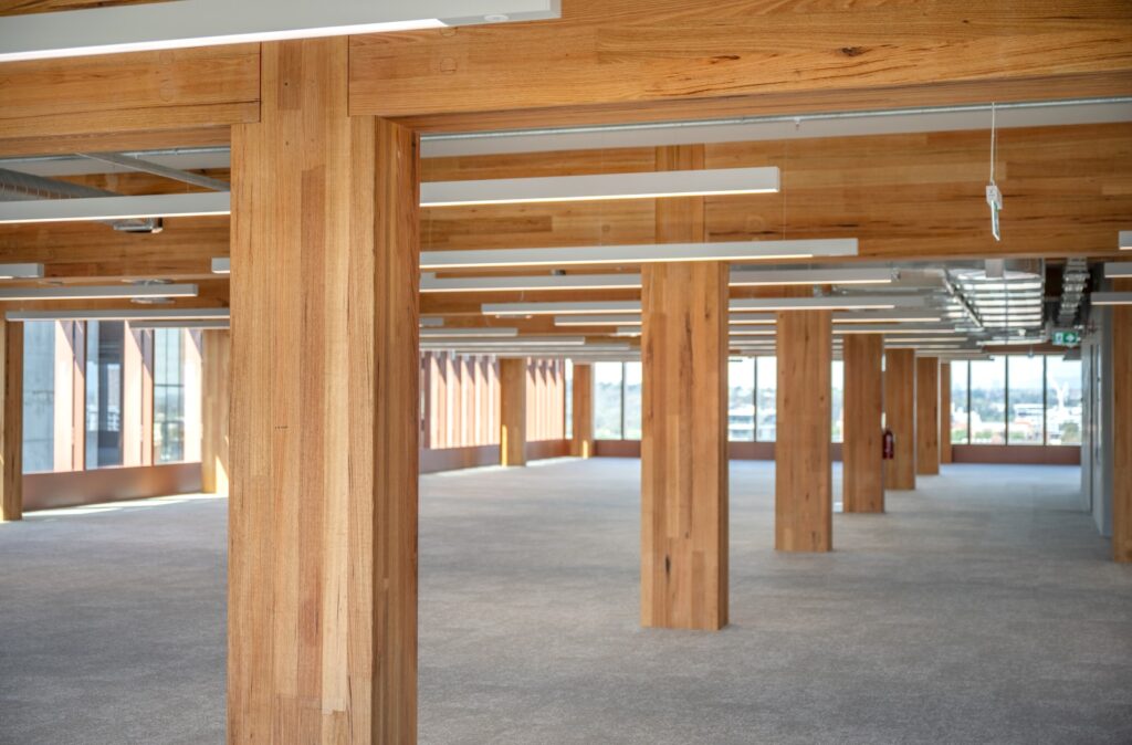 Internal view of T3 Collingwood mass timber office building. Image: ICON Internal view of the completed T3 Collingwood mass timber commercial office tower by Hine, featuring ASH's MASSLAM. Image courtesy: ICON
