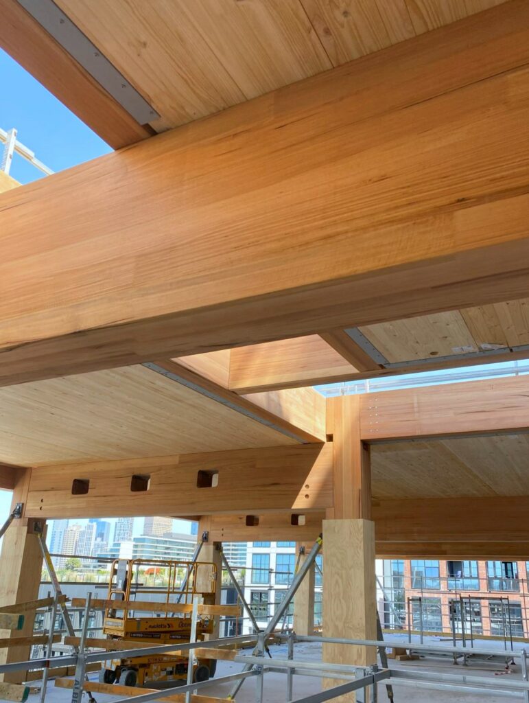 T3 Collingwood during construction featuring MASSLAM columns and beams. Image: ASH T3 Collingwood during construction featuring ASH's MASSLAM (mass timber) columns and beams. Image credit: ASH