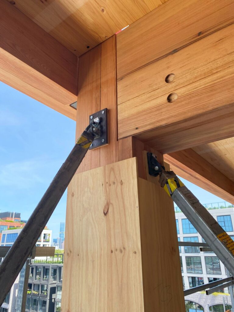 T3 Collingwood during construction highlighting unique MASSLAM bearing connection. Image: ASH T3 Collingwood during construction featuring ASH's unique MASSLAM (mass timber) bearing connection. Image credit: ASH