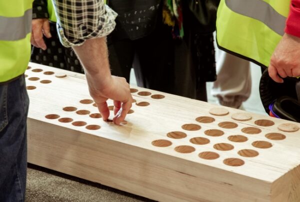 MASSLAM-Open-Day (69)_web Attendees getting testing the precision of mass timber plugs at our MASSLAM Open Day at ASH's production facility in Heyfield.