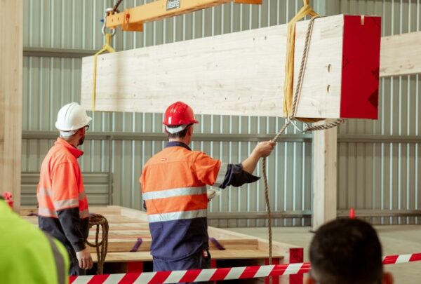 MASSLAM-Open-Day (73)_web Attendees at ASH's MASSLAM Open Day witnessing a live, full-scale installation demonstration of our MASSLAM bearing connection at our Heyfield mass timber production facility.