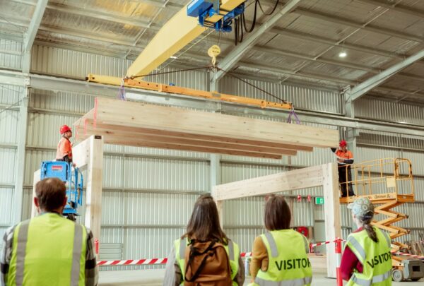MASSLAM-Open-Day (82)_web Attendees at ASH's MASSLAM Open Day witnessing a live, full-scale installation demonstration of our Advanced Timber Composite (ATC) flooring at our Heyfield mass timber production facility.