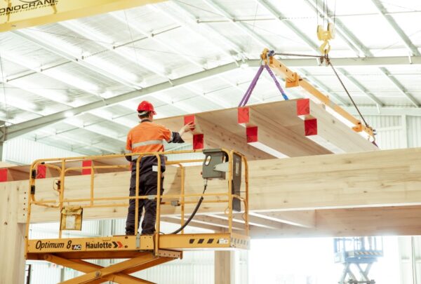 MASSLAM-Open-Day (88)_web Attendees at ASH's MASSLAM Open Day witnessing a live, full-scale installation demonstration of our Advanced Timber Composite (ATC) flooring at our Heyfield mass timber production facility.
