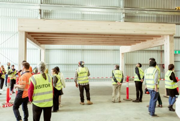 MASSLAM-Open-Day (91)_web Attendees at ASH's MASSLAM Open Day getting a close up look at our Advanced Timber Composite Flooring (ATC) solution after witnessing a live, full-scale installation demo at our Heyfield mass timber production facility.