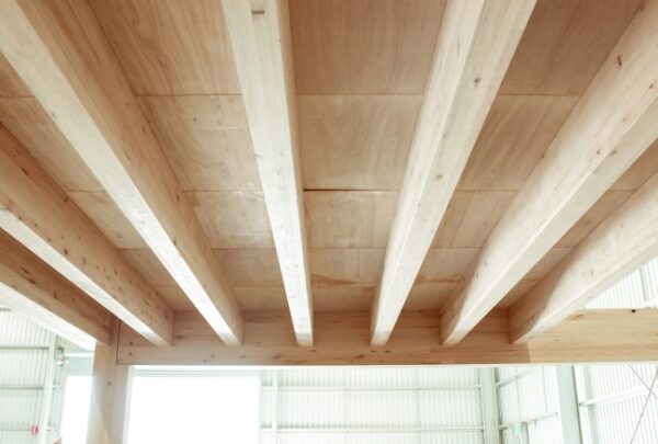 MASSLAM-Open-Day (98)_web Attendees at ASH's MASSLAM Open Day getting a close up look at our Advanced Timber Composite Flooring (ATC) solution after witnessing a live, full-scale installation demo at our Heyfield mass timber production facility.