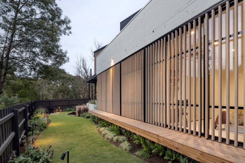 Outdoor area of Denman Avenue by Orbis Constructions featuring ASH's IronOak external hardwood battens.