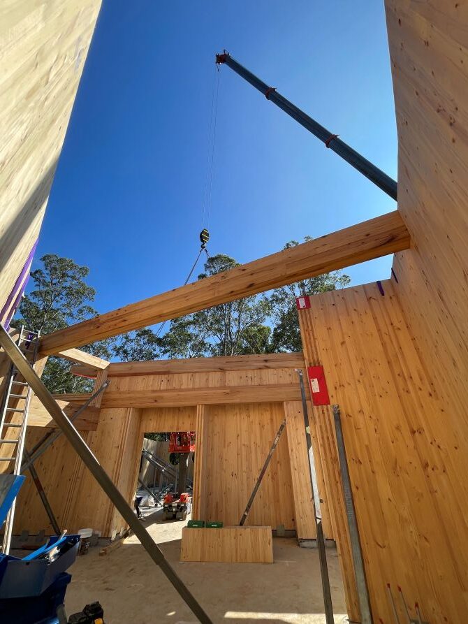 ASH glulam beams being craned into place during construction of Grace Village ELC in Bankstown NSW. Image courtesy: XLAM